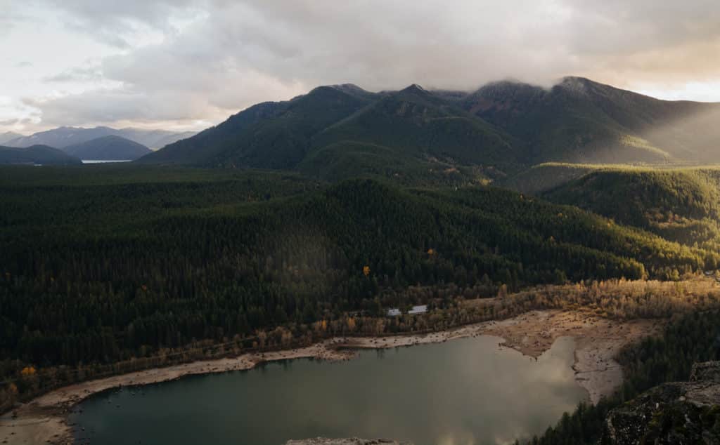 The view from the Rattlesnake Ledge overlook, with Rattlesnake lake below and mountains in the distance.