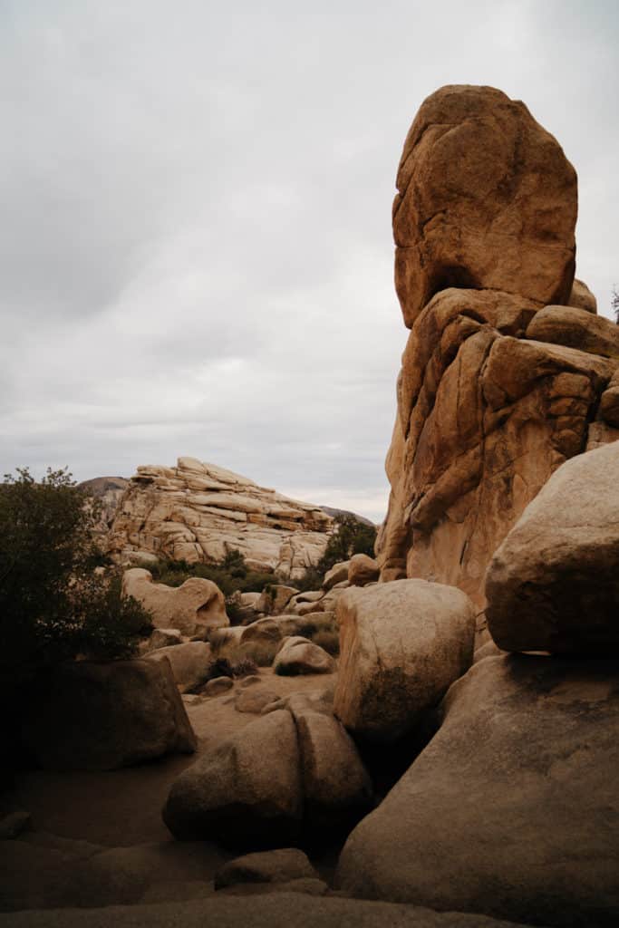 A vista at the Hidden Valley Nature Trail, with a rocky pinnacle in the foreground and more boulder formations in the background.