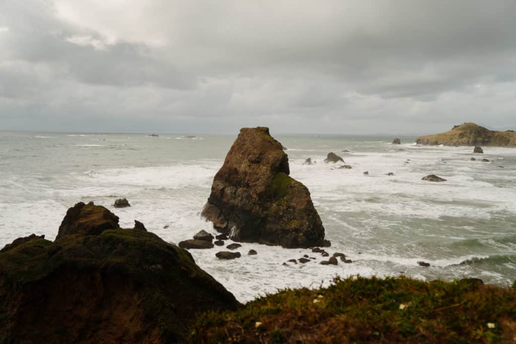 A view of a sea stack from Otter Point, a hike on the Oregon Coast.