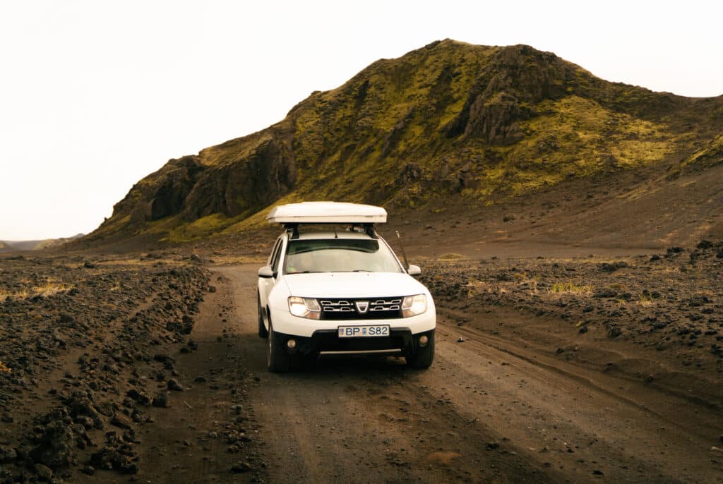 Me driving in Iceland - a Dacia Duster on a dirt road in the Westfjords.