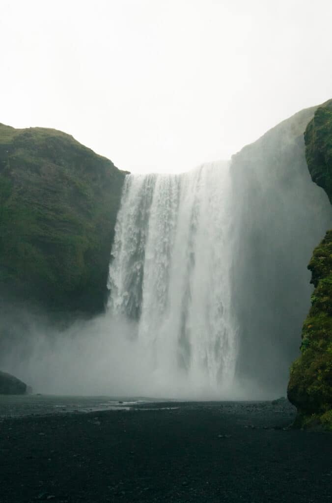 A view of Skogafoss, which is one of the best waterfalls in Iceland, from the base of it.
