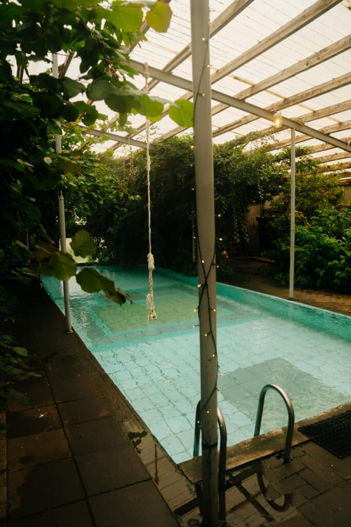 The warm pool inside the greenhouse at the Hotel Heydalur.