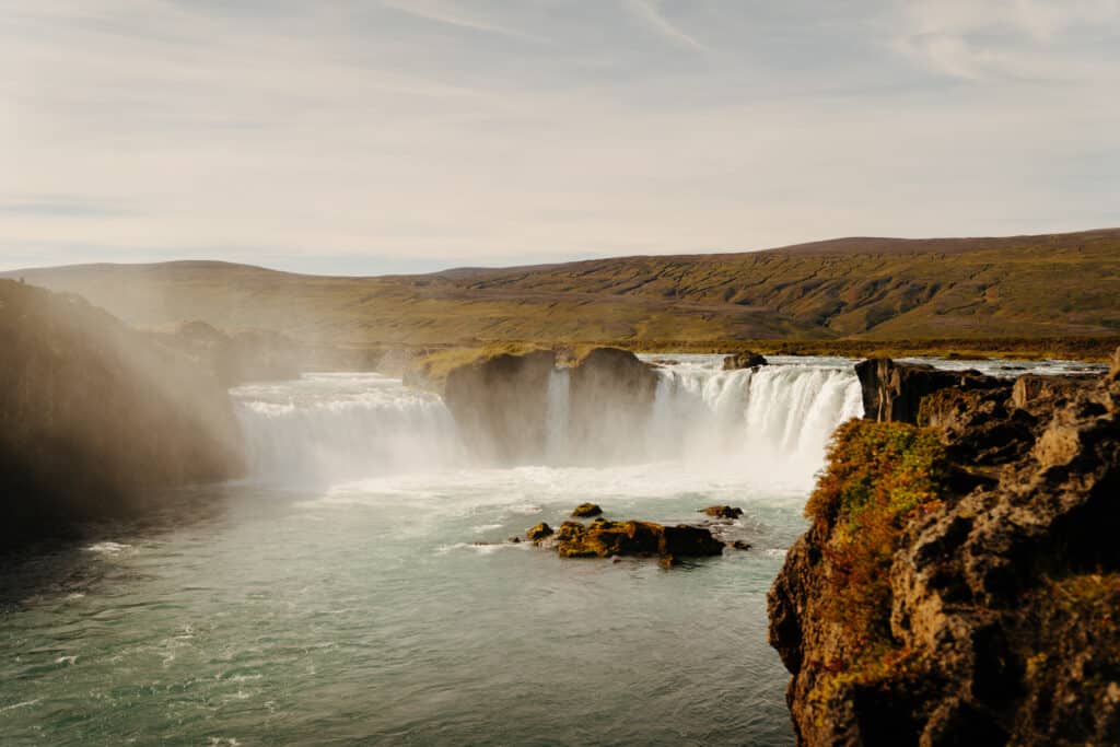 A view of Godafoss waterfall cascading into the river, just off of the Ring Road in Iceland.