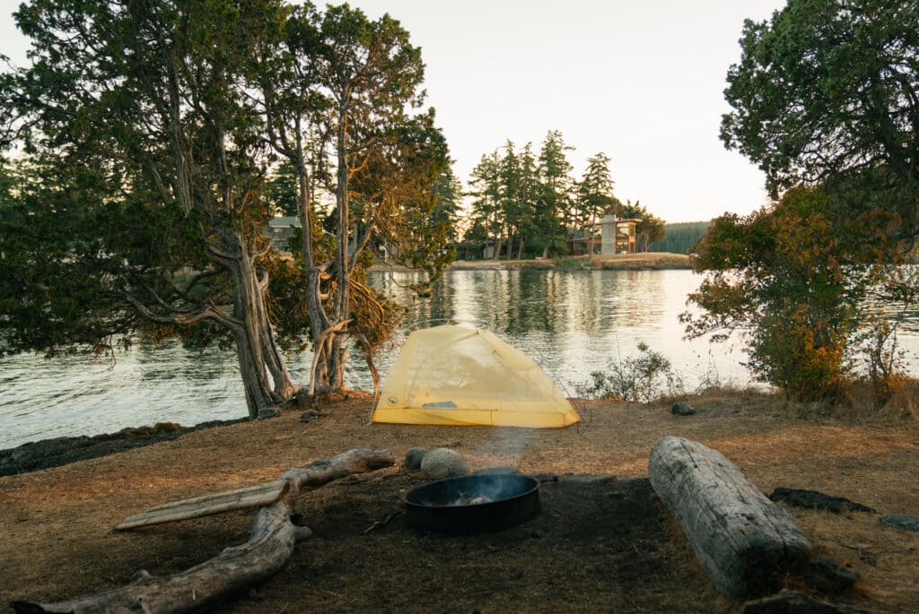 A tent at Site #1 on Posey Island, with a view of the ocean.