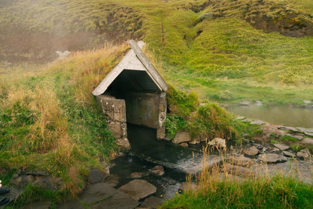The hut at Hrunalaug hot spring, which is one of the best things to do in Southern Iceland.