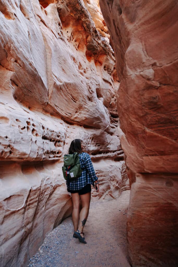 Me walking through a slot canyon on a hike in Valley of Fire State Park.