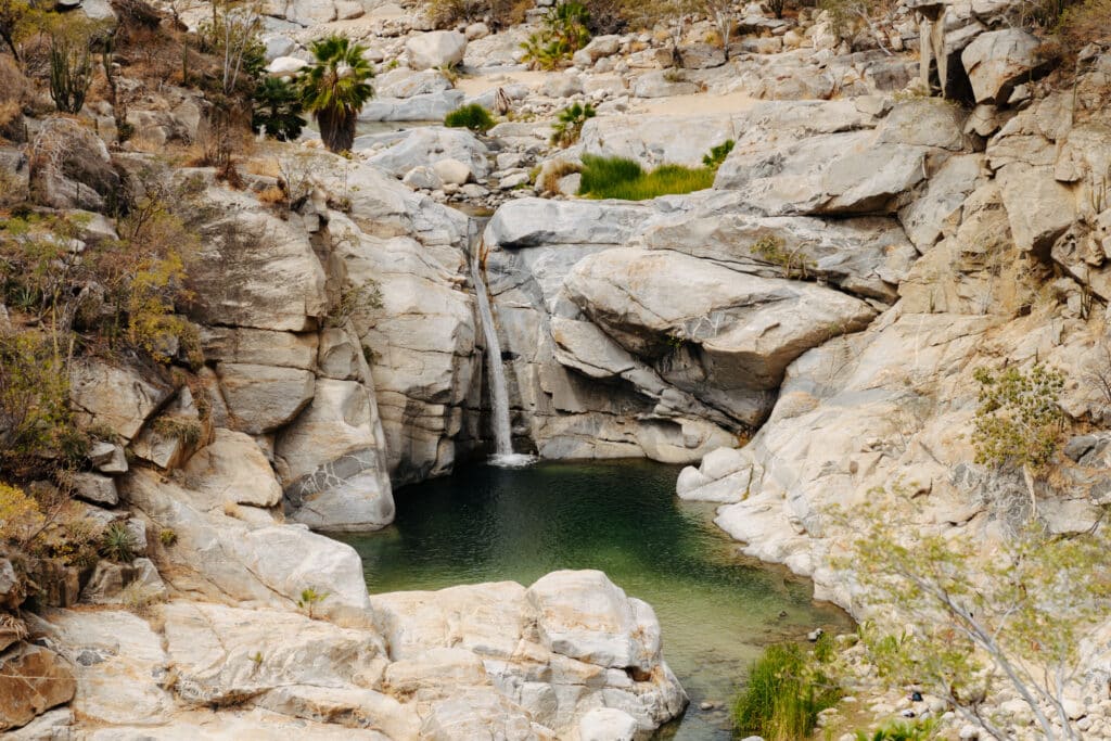 A view of a waterfall - Canon de la Zorra is a great stop along this Baja road trip itinerary!